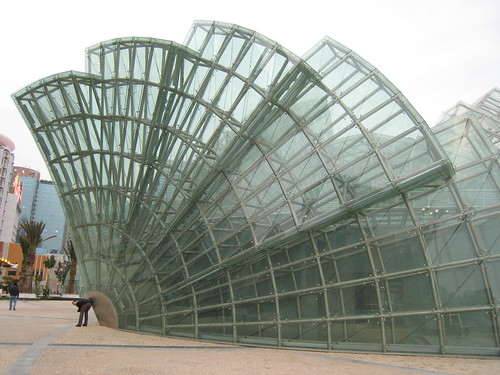 Exploring Macau - Damon posing with the giant glass structure - funny... :)