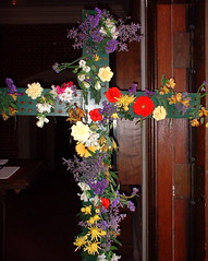 cross with holes for flowers before Easter services