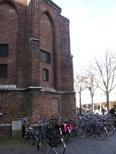 Bikes in front of an old church.