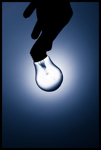 image of hand lighting lightblub