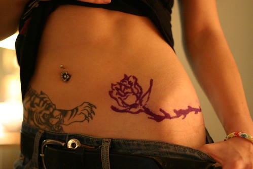 Lower Stomach Tattoo Design For Girls And Woman With Symbol Tattoo