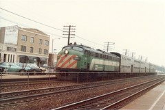 Burlington Northern commuter train approaching the La Grange Road commuter rail station. La Grange Illinois USA. Febuary 1985.