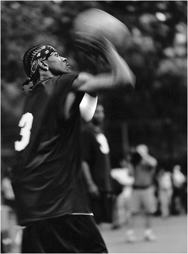 Photo of Allen iverson shooting basketball at Rucker Park in Harlem NY.