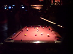 People Playing Pool at Trunks