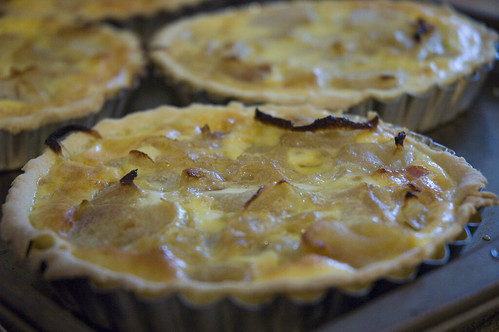caramelized onion and apple tarts with pancetta and aged cheddar