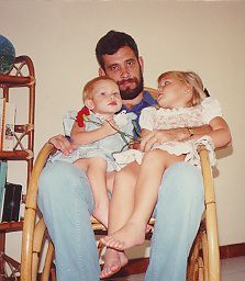 A rocking chair on Guam in 1988 with Abbey in blue, on my right...