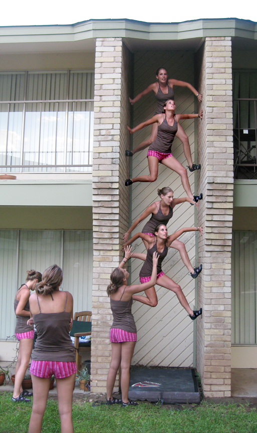 Huge coloumn of multiplcity clone girls climbing tall building