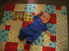 Max tries out his new quilt