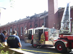 Roof damage, wisps of smoke, western (rear) facade, Eastern Market DC