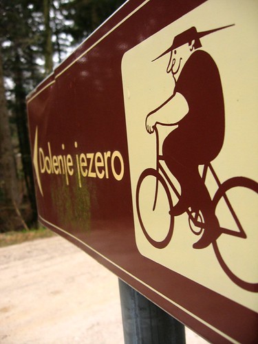 Bicycle route sign near Cerknica Lake, Slovenia