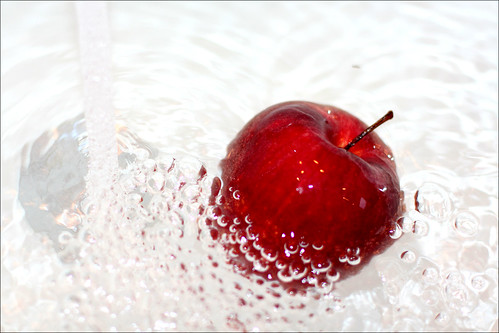 Washing red apple