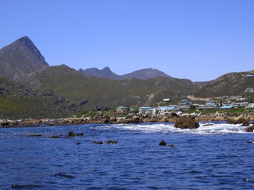 Rooiels from the sea. The mountains of the Kogelberg Nature Reserve rise green in the distance. The reserve is now a World Heritage Site.