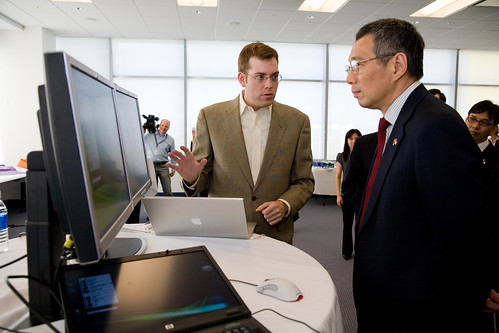 The Prime Minister of Singapore, Lee Hsien Loong watching a product ...