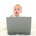 Baby Girl Working On Laptop por redactie ikvader.nl