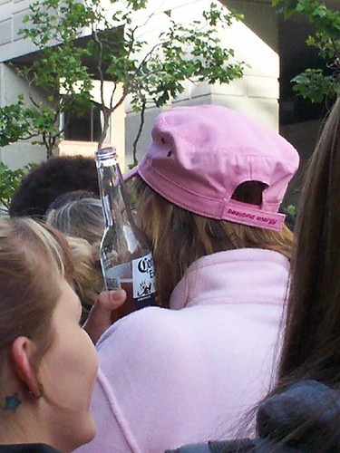 woman holding bottle of Corona