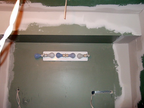 ceiling greenboard and corner stripping near the vanity