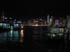 Hong Kong at night - city skyline across the harbor - taken from the Star Ferry ramp