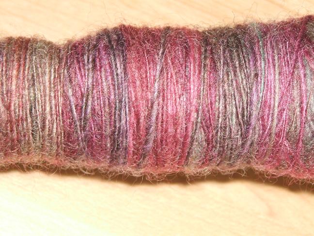 cose up of yarn on the spindle
