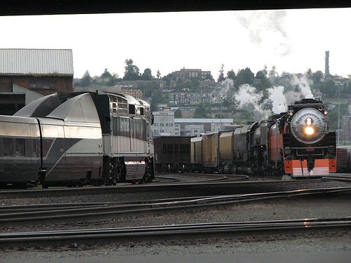 An Amtrak Cascades train meets the Portland Rose steam special