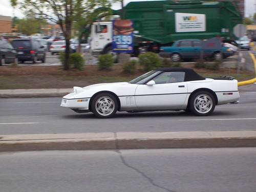 A white Corvette C4 convertible