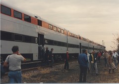 Passengers detraining for photo runbys. Photographed near Harvard Illinois, during the Saturday , October 28th  1989  C&NW / Metra  EMD E-8  Last Run fantrip from Chicago to Harvard Illinois.