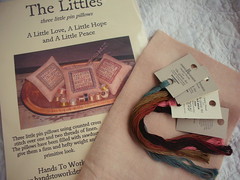 The Littles with fabric and threads