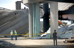 fallen overpass with workers