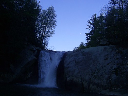 waning moon over waterfall