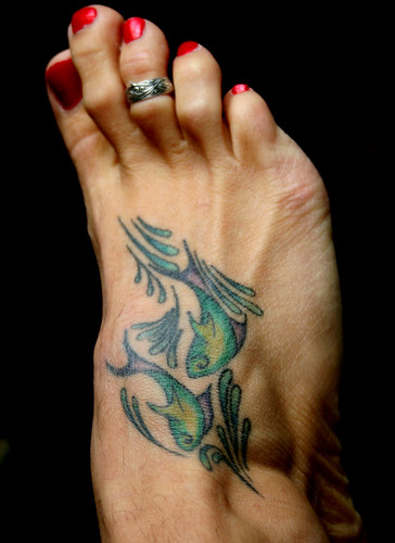 Colourfull Pisces Tattoos painted on foot.