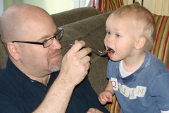 Quinn gets a bite of cake from Daddy