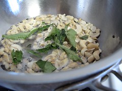 Split black gram- mustard seeds- cashews and curry leaves in groundnut oil for Upma.jpg