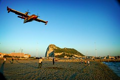 canadair making final approach with gibraltar's rock in the back