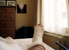In bed with a broken foot.