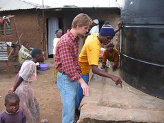 Kiswahili lessons by a community water tank in Kibera slum, Nairobi, Kenya