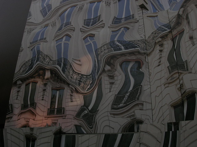 39 Avenue George V in Paris 8. Trompe l&squot;oeil images by Athem as part of the "Manifeste du Surréalisme Urbain" hide renovation work on the building behind,