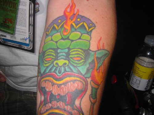tiki tattoos. This tiki Yoda tattoo ended up
