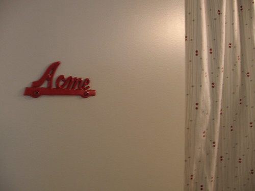 On the door, a vintage Acme sign that I painted red