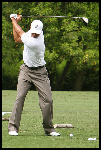 tiger woods swinging. Tiger Woods