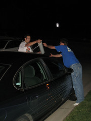 Corey and Ben shrinkwrap John's car