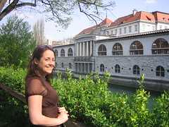 Sheri in front of the river with the market in the background