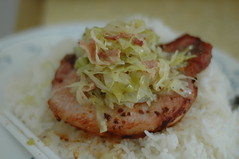 Mien Broiled Pork Chop topped with cabbage and bacon