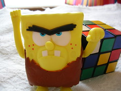 Neanderthal SpongeBob flies into a fit of rage when he realizes that he lacks the mental faculties to solve the Rubik's Cube.