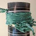 pole wrapped teal green silk