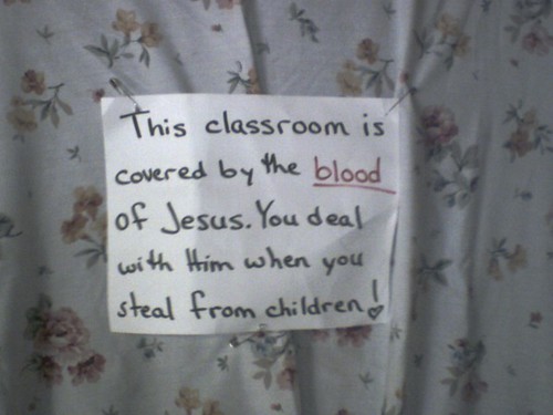 This classroom is covered by the blood of Jesus. You deal with Him when you steal from children!