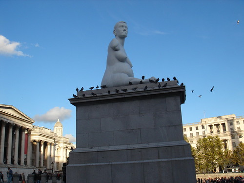 Statue of Alison Lapper in Trafalgar Square with pigeons surrounding her