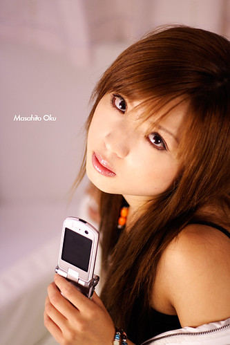 Sexy Young Girl Model for Advertising photograph of mobile phone