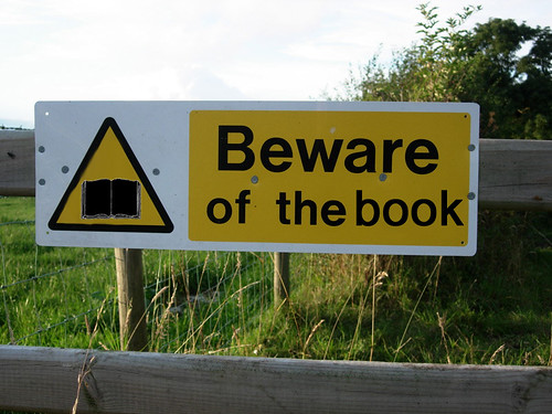 Beware of the book sign