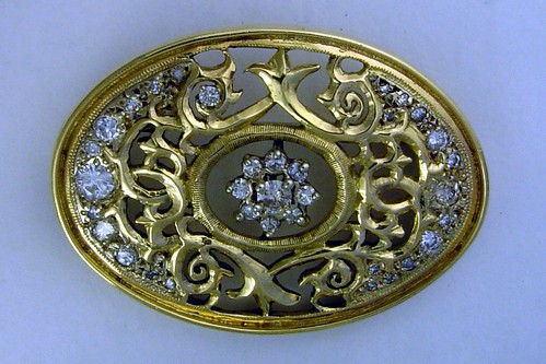 Diamond, florentine oval broche, gold by Somma.
