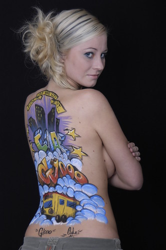 sexy girl body painting art with libra symbol, city picture, and flag in the world