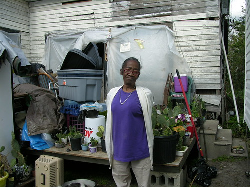 an elder who didn't get assistance after hurricane katrina, without a trailer living in an open house